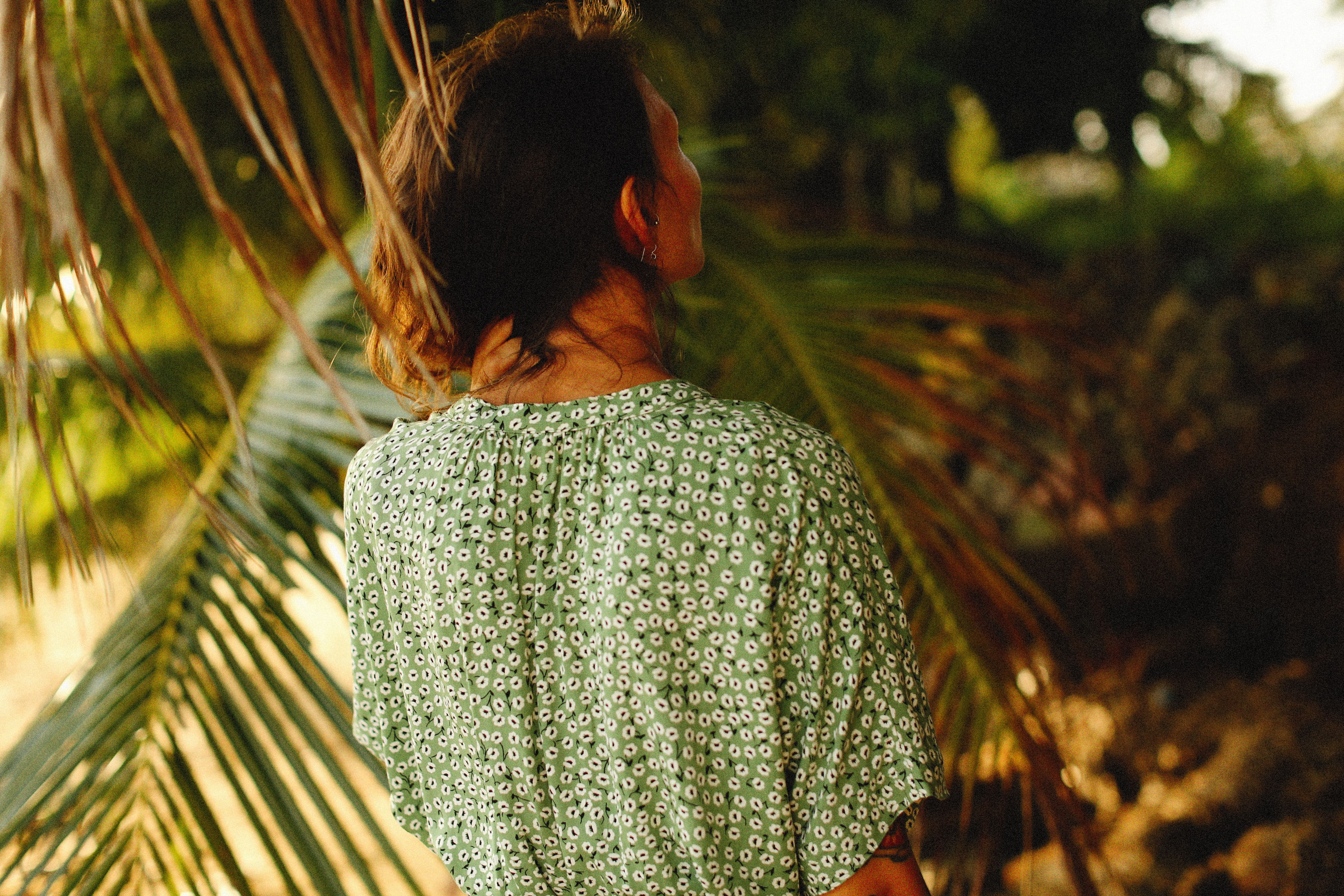 Close Up Photo of Woman Wearing Floral Top · Free Stock Photo
