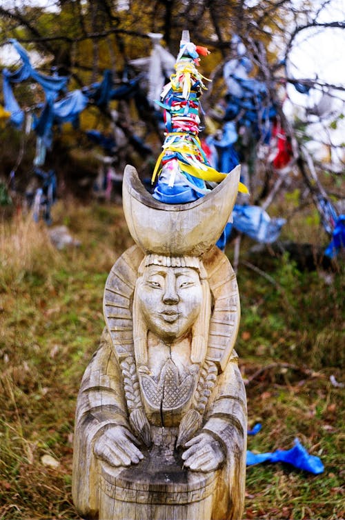 A Sculpture on Green Field in Close-up Photography