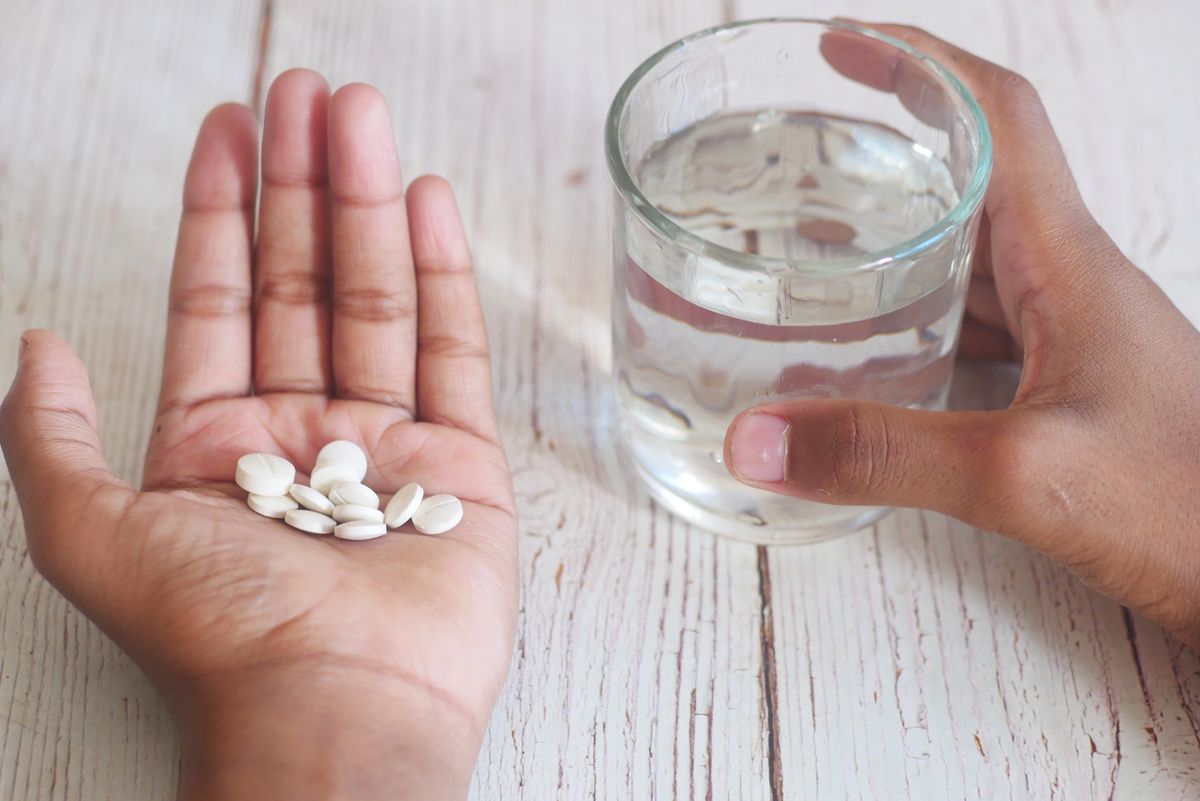 Tablets and a glass of water