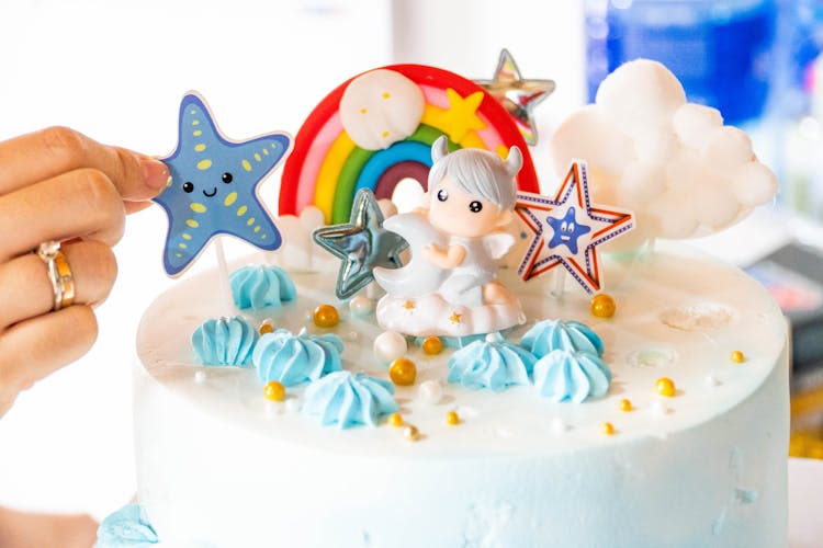 White Cake With Blue And Yellow Star Cake Topper