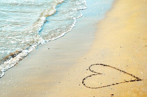 Free Heart Shaped Drawing on the Sand  Stock Photo