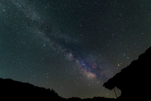 Free A stunning view of the Milky Way galaxy illuminating the night sky with countless stars. Stock Photo