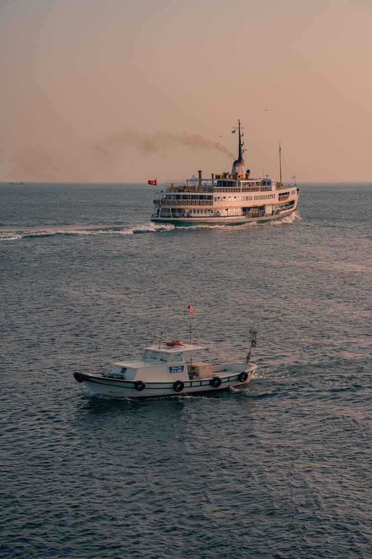 Motorboat And Cruise Ship On Open Water