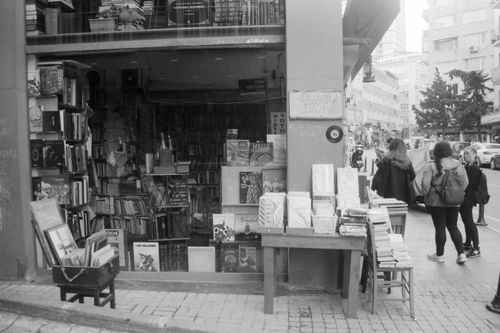 Free Black and white photo of a bustling bookstore with street shoppers. Stock Photo