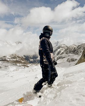 A snowboarder glides down the snowy slopes of Stubai Glacier in Austria, embracing winter adventure.