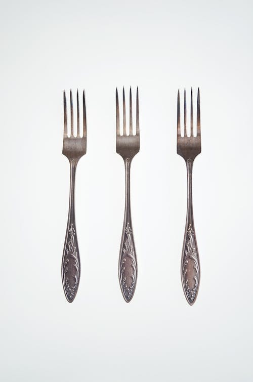 Forks on White Surface