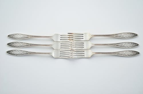 Six Forks on White Surface