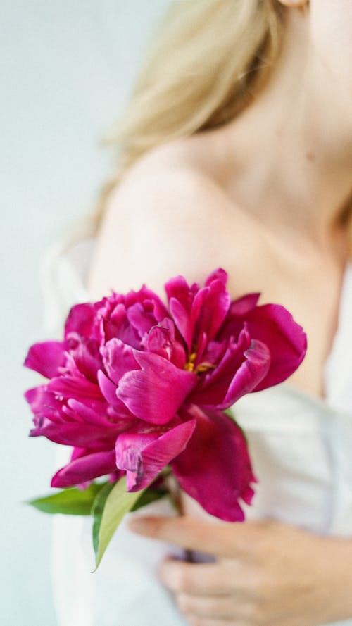 Woman Holding a Flower