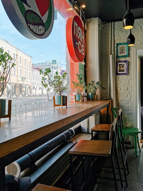 Wooden Counter with Chairs in a Café Bar