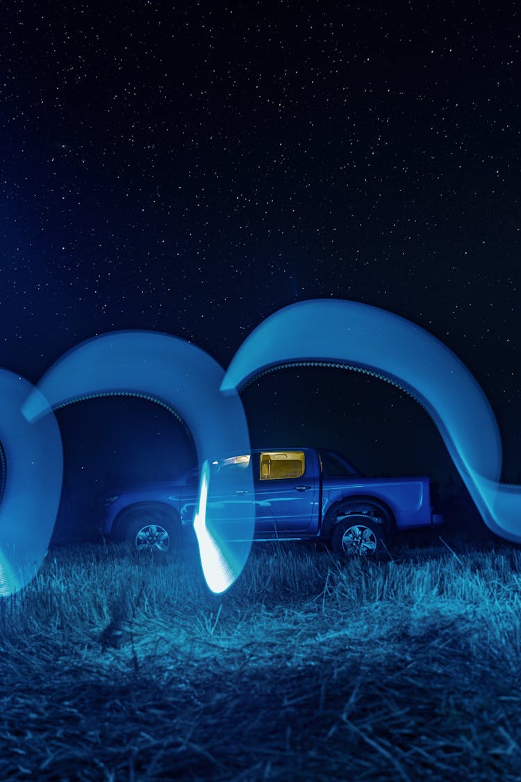 Car In Field At Night