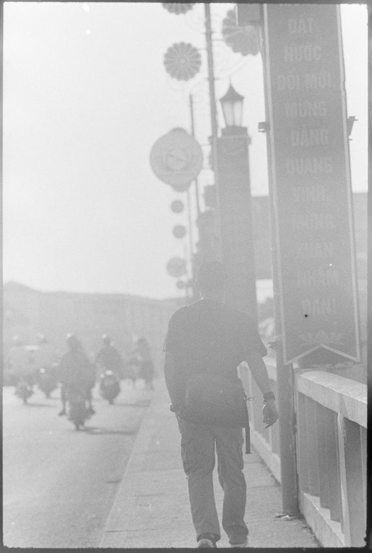 Framed Blur Picture Of Man Walking City Street