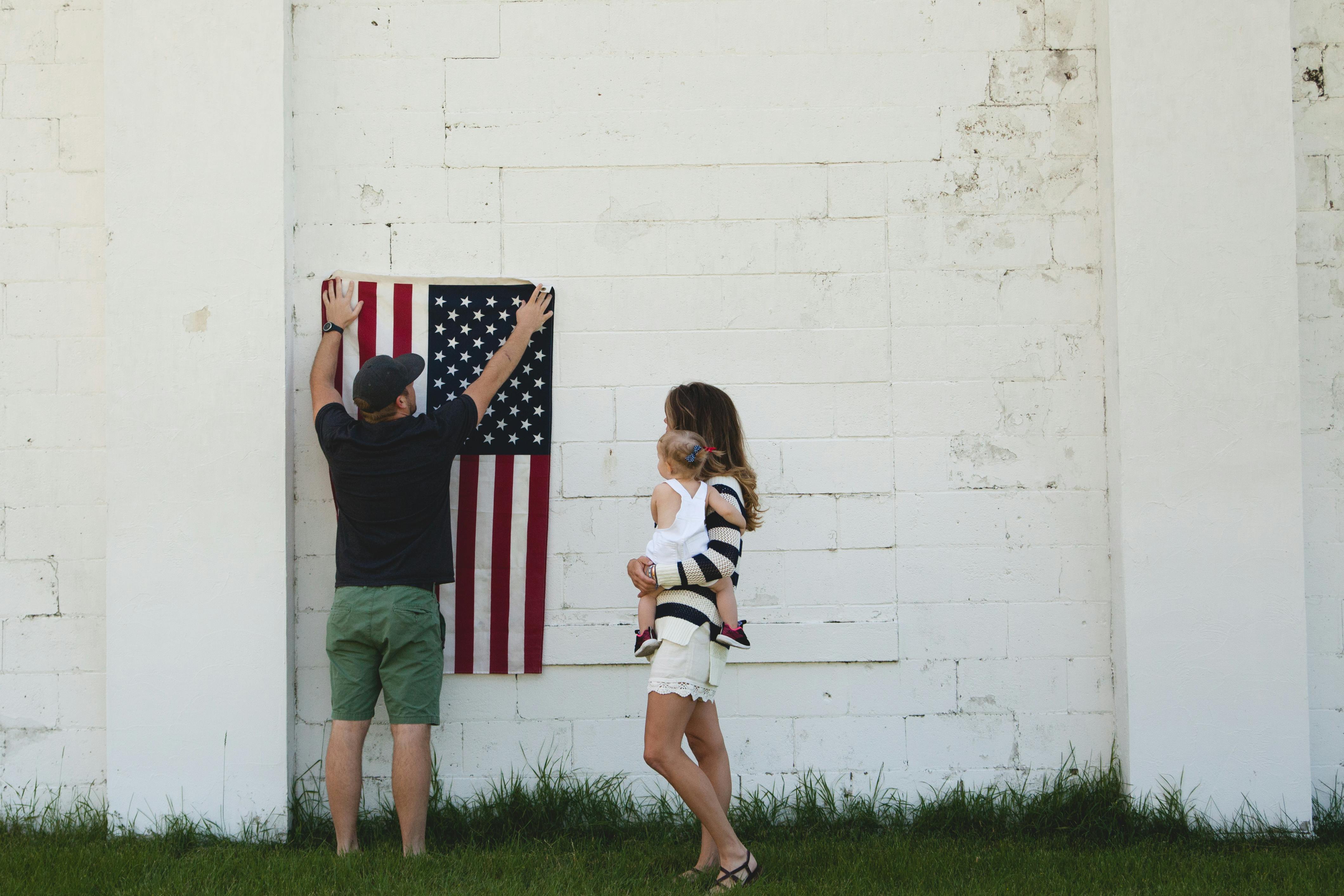 man holding u s flag