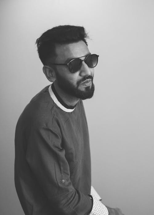 Monochrome Photography of Man Wearing Sunglasses