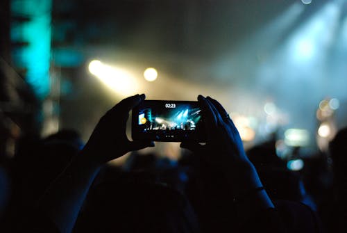 Free Photo of Person Recording Video on a Concert Stock Photo