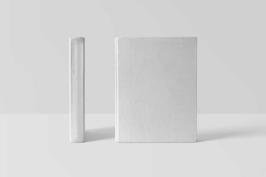 Two cloth-bound covers standing on a pale surface — photo by Mr. Mockup on Pexels
