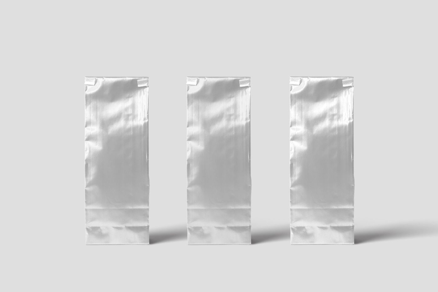 Three sleek silver specialty coffee packaging bags: Meridian brand and packaging project