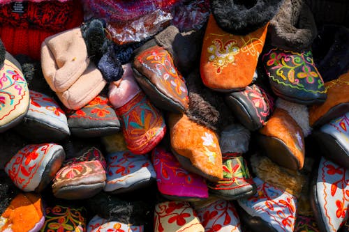 A Pile of Soft Shoes with Embroideries