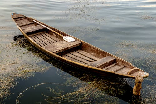 A Wooden Boat in a Lake 