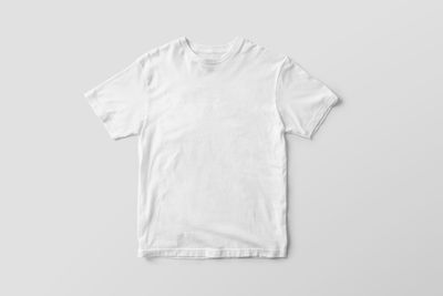 Blank white t-shirt laid flat, ready for artwork. Photo by Mr. Mockup on Pexels.