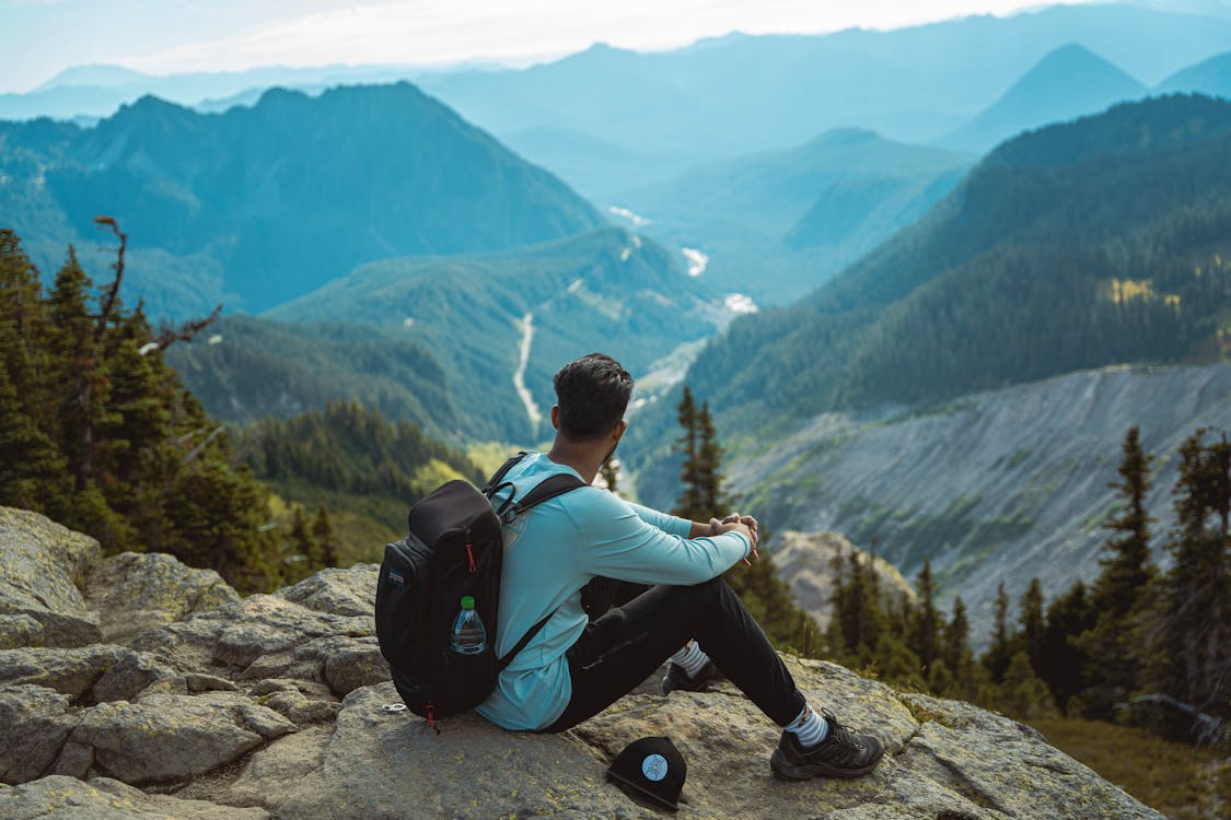 Photo of Man Looking at Mountain Landscape · Free Stock Photo