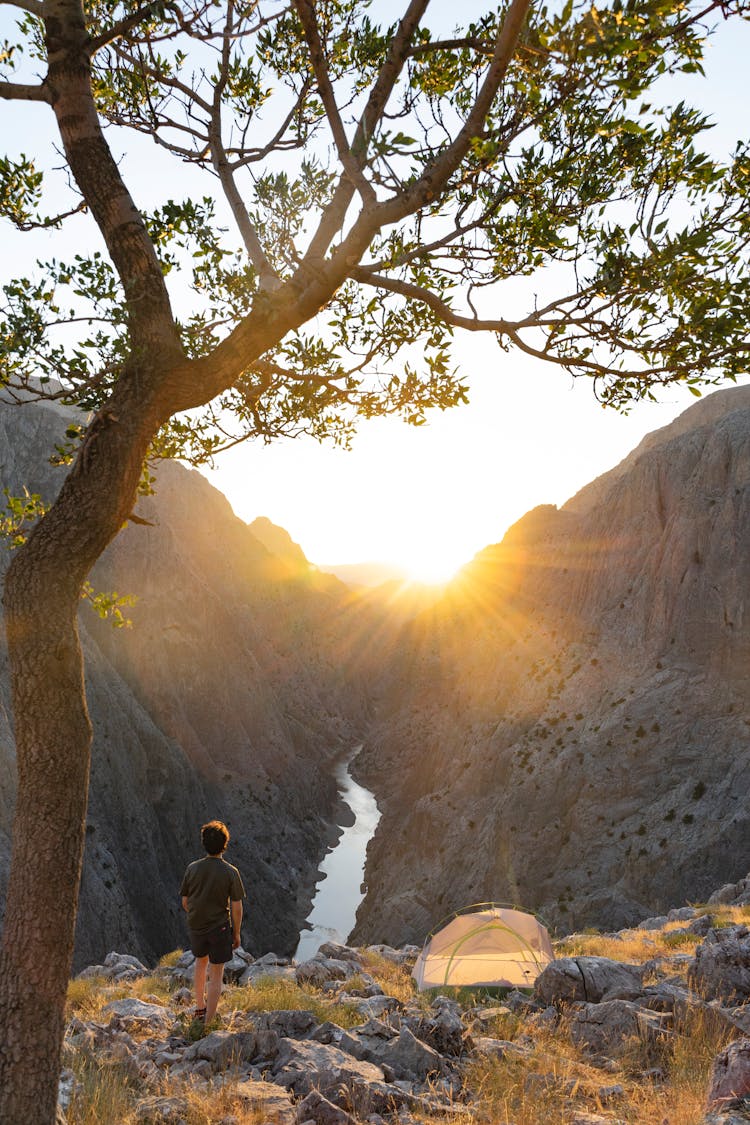 Man Standing On Mountain Top