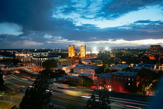Aerial view of Sacramento showcasing the cityscape, skyline, and Tower Bridge at twilight.