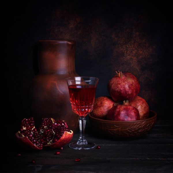 Still life with pomegranates and a rustic jug — Максим Вышарь on Pexels