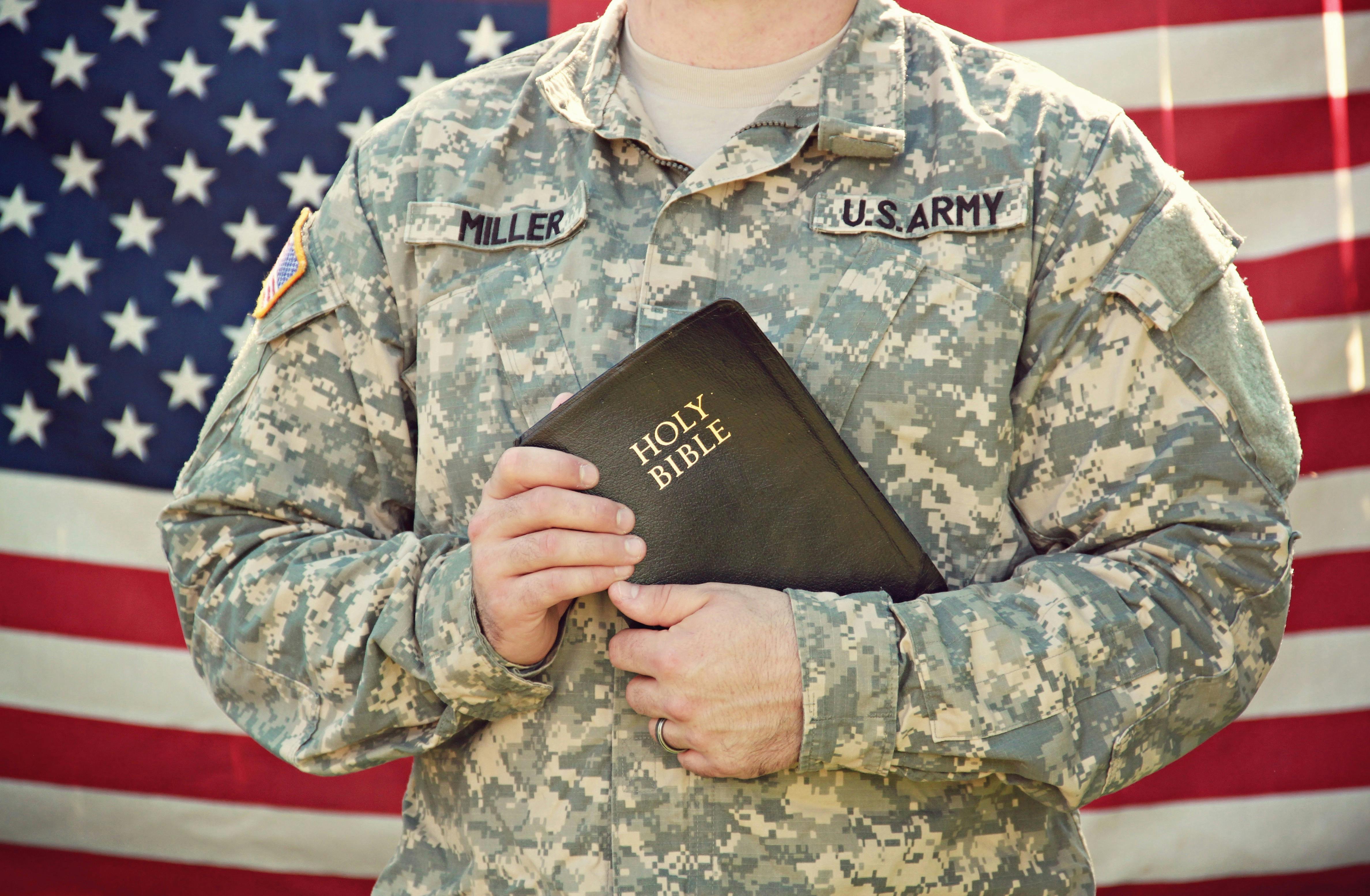 man holding bible