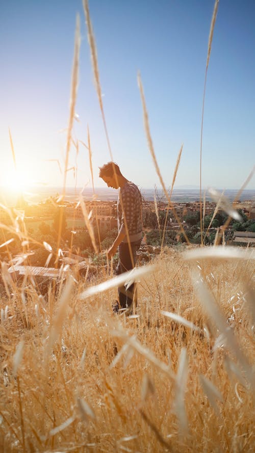 Man Standing on Mountain Top