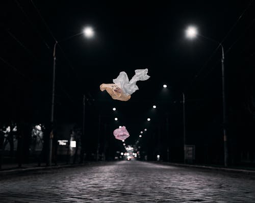 Cloth Flying in Air on Dark City Street
