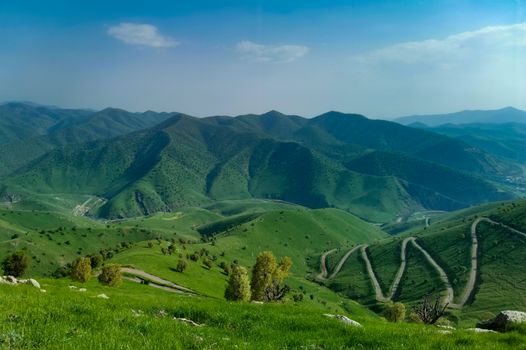 Beautiful rolling green hills in Sulaymaniyah, Iraq, showcasing nature's vibrant beauty.