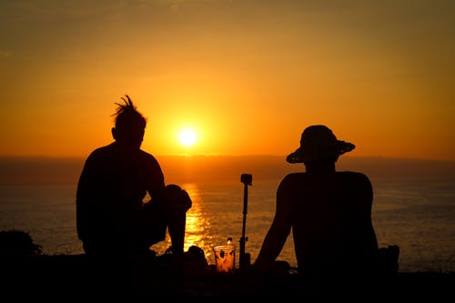 A Two Men Looking the Sunset Together 