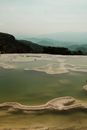 Lime Rock Formations in Lake on Natural Terrace in Mountains