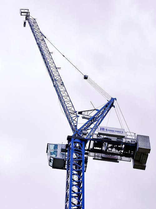 Free Blue Tower Crane Under Clear Sky Stock Photo