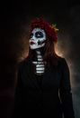Woman in Black Blazer With Red and White Face Mask