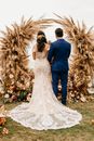 Couple in front of the Altar at an Outdoor Wedding