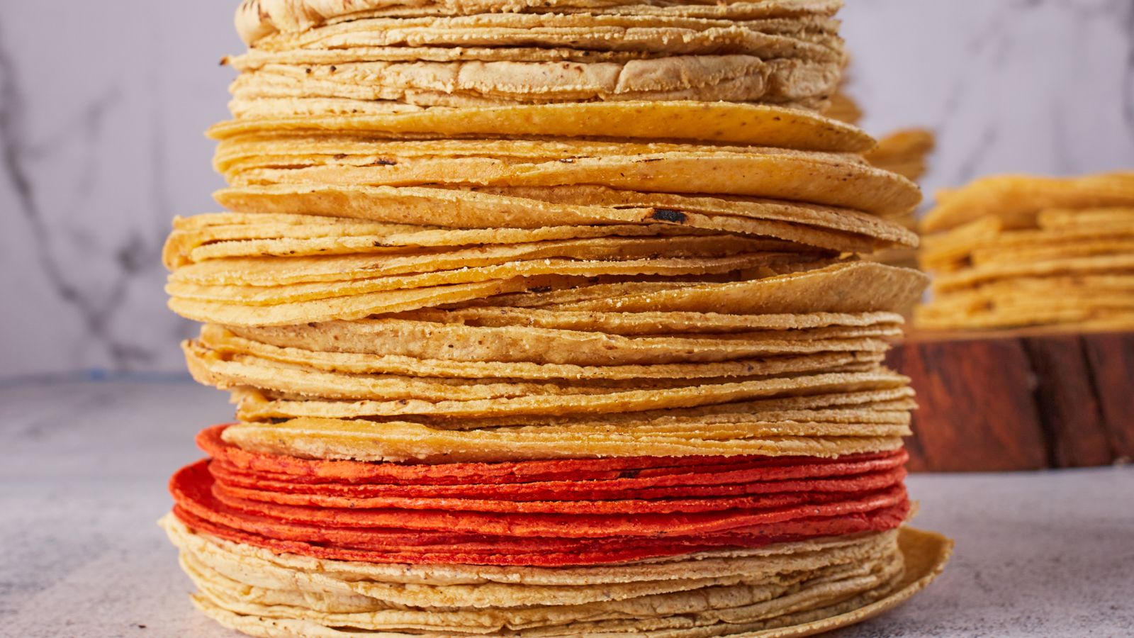A tall stack of fresh corn tortillas on a kitchen countertop — photo by Israel Albornoz on Pexels A tall stack of fresh corn tortillas on a kitchen countertop