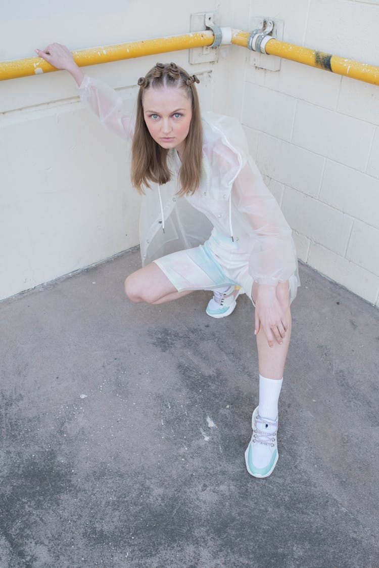 Blue Eyed Woman Wearing White Raincoat 