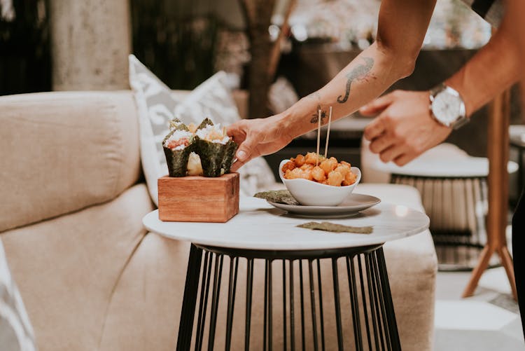 Serving Asian Food On Table In Restaurant