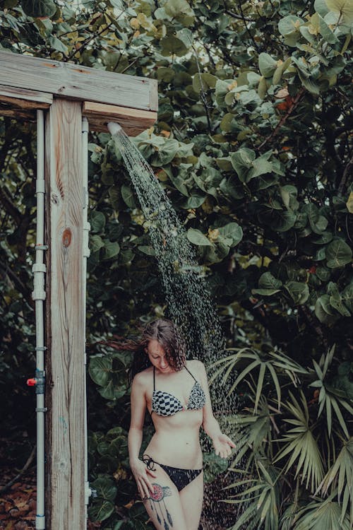 Free Woman in Bikini Taking a Shower Stock Photo