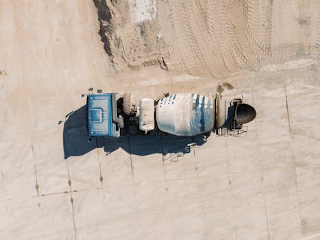 Drone image of a concrete mixer truck on a construction site in Novosibirsk, Russia.