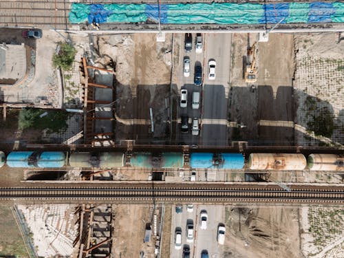 Drone Shot of Crossing Road and Train Tracks