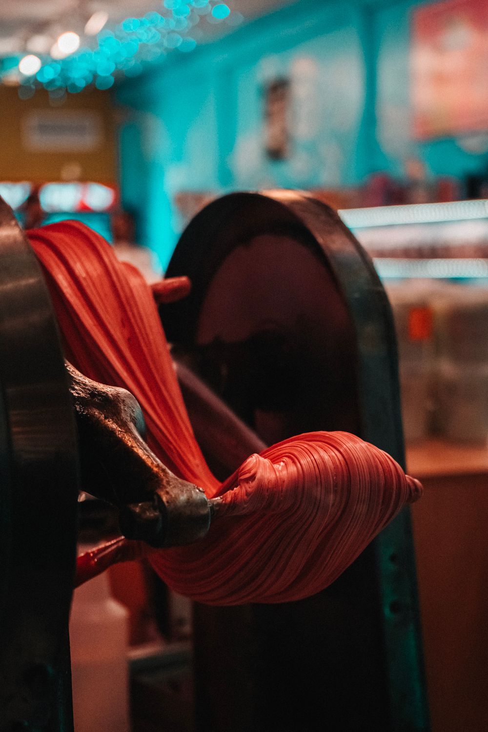 A candy pulling machine turning warm sugar