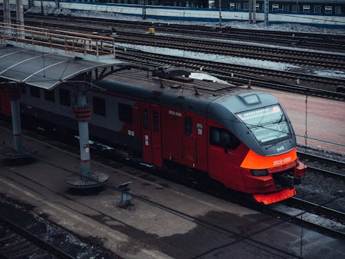 Free Red Train Parked on a Station Stock Photo