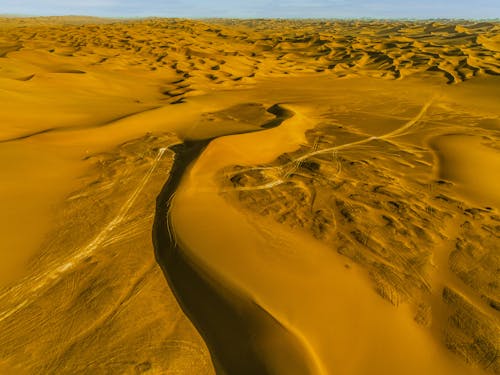 Vehicles Tracks in the Kumtag Desert, China