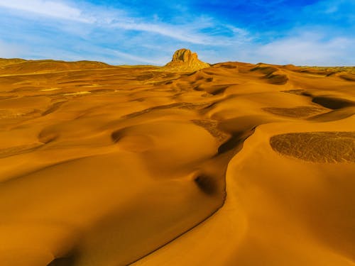 Golden Sand Dunes and Rock Formations in the Desert 