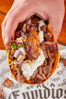 Mouth-watering taco with flavorful beef, salsa, and onions, captured in Monterrey, Mexico.