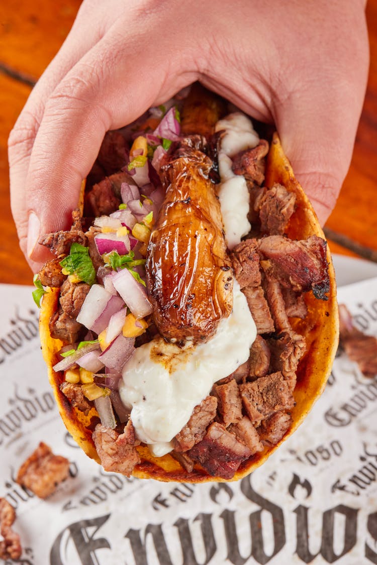 Close-Up Of A Taco In A Hand