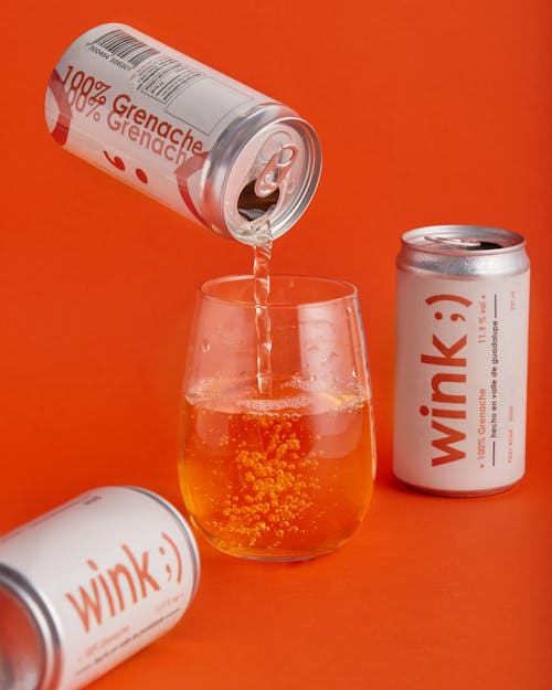 A Can of Grenache Wine being Poured into a Glass