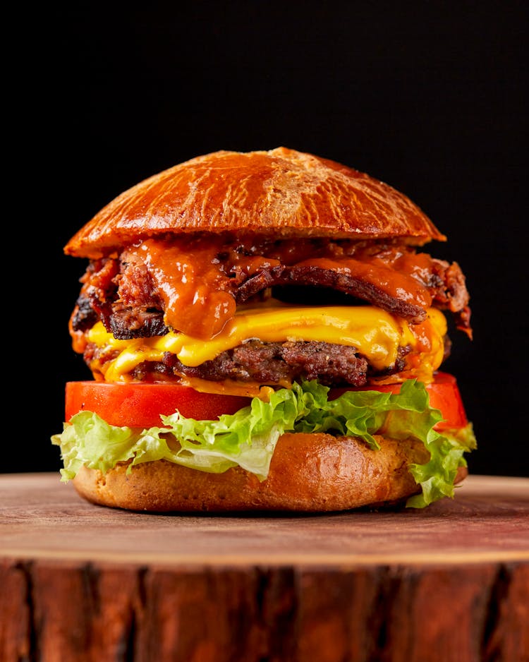 Close-Up Of A Hamburger On Black Background